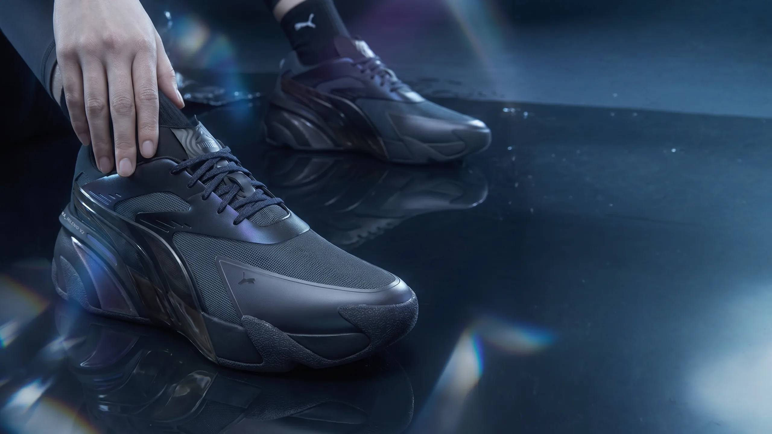 PUMA Milenio redesign worn on a wet reflective floor